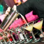 Barman?s hand with shaker and cocktails